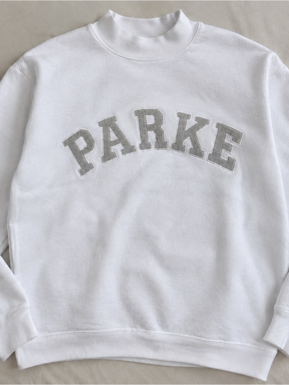 White Crewneck Sweatshirt with Gray PARKe Appliqué